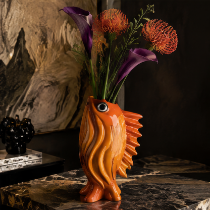 Stable Elegant Base — bottom view of orange goldfish vase showing four rubberized feet for refined home experience