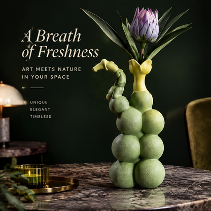 Bubble ball stack vase with yellow floral rim and seahorse handle in sage green ceramic with purple king protea on dark marble