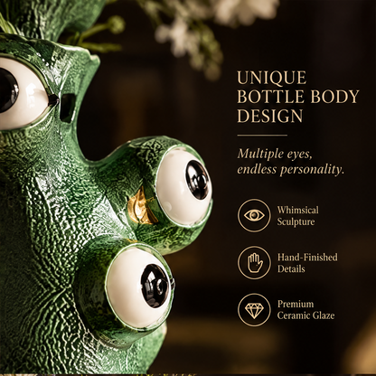 Art Meets Nature — green monster vase with expressive eyes and wildflowers, showing distinctive form and handcrafted ceramic