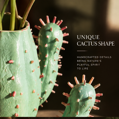 Bloom Differently — mint green cactus vase with pink spines and anthurium in warm ambient interior with artistic design