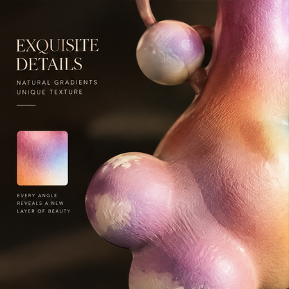 Gradient ceramic vase styled on dark marble surface with pink orchids — lifestyle scene