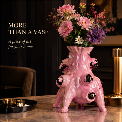 Exquisite Details — close-up of pink ceramic monster vase eyes with gold iris rings and black pupils crafted with artistic soul